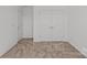 Neutral bedroom featuring double door closet and neutral tones at 15926 Parkside Crossing Dr # 322, Charlotte, NC 28273