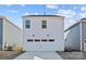 Detached two-car garage with a large concrete driveway, offering ample parking space at 15926 Parkside Crossing Dr # 322, Charlotte, NC 28273