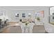 Bright and airy living room with a dining area and a white staircase at 15926 Parkside Crossing Dr # 322, Charlotte, NC 28273