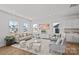 Spacious living room filled with natural light, neutral furniture, and views from the large windows at 15926 Parkside Crossing Dr # 322, Charlotte, NC 28273
