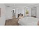 Relaxing main bedroom with ensuite bathroom and comfortable sitting area by the window at 15926 Parkside Crossing Dr # 322, Charlotte, NC 28273