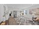 Well-lit home office with desk, shelving, artwork, and comfortable seating, and carpeted floor at 15926 Parkside Crossing Dr # 322, Charlotte, NC 28273