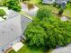 Aerial view of the property showcasing the roof, landscaping, and nearby pond at 1678 Onyx Rdg, Fort Mill, SC 29708