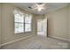 Bedroom featuring neutral walls, carpet flooring, window with blinds, and a ceiling fan at 1678 Onyx Rdg, Fort Mill, SC 29708