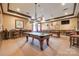 Well-appointed billiard room featuring two pool tables, decorative lighting, and comfortable seating at 1678 Onyx Rdg, Fort Mill, SC 29708