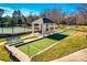 Community bocce ball court with a covered gazebo and benches for residents to relax and socialize at 1678 Onyx Rdg, Fort Mill, SC 29708