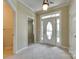 Bright foyer with neutral walls, tile flooring and an entrance door with sidelights at 1678 Onyx Rdg, Fort Mill, SC 29708