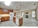 Open concept kitchen flows into living room, stainless appliances, and ample counter space at 1678 Onyx Rdg, Fort Mill, SC 29708