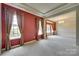 Open concept living room and dining area with large windows and neutral carpet at 1678 Onyx Rdg, Fort Mill, SC 29708