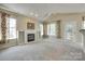 Inviting living room with a fireplace, built-in shelves, and natural light at 1678 Onyx Rdg, Fort Mill, SC 29708