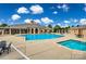 Outdoor community pool with lounging areas and shaded seating, perfect for relaxation and social gatherings at 1678 Onyx Rdg, Fort Mill, SC 29708