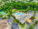 Expansive community pool area with a tennis court, lush green spaces, and ample parking for visitors at 1678 Onyx Rdg, Fort Mill, SC 29708