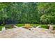 Backyard with a trampoline, a swing, a fountain, and stone pavers at 201 Mills Ln, Fort Mill, SC 29708