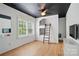 Bright bedroom with hardwood floors, a built-in bunk bed, and a modern ceiling fan at 201 Mills Ln, Fort Mill, SC 29708