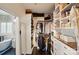 Well-organized walk-in closet with custom shelving, drawers, and a view of the modern bathroom at 201 Mills Ln, Fort Mill, SC 29708