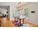 Bright dining area with modern chandelier, large windows, and colorful rug at 201 Mills Ln, Fort Mill, SC 29708