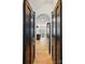 Hallway featuring sliding doors that lead to the kitchen and dining area at 201 Mills Ln, Fort Mill, SC 29708