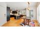 Open concept kitchen and dining area with hardwood floors and stylish decor at 201 Mills Ln, Fort Mill, SC 29708