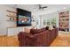 Cozy living room features modern built-in shelving, a large TV, and a comfortable sectional couch at 201 Mills Ln, Fort Mill, SC 29708