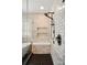 Detailed view of shower with marble tile, black fixtures, and a built-in marble bench at 201 Mills Ln, Fort Mill, SC 29708