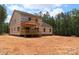 Spacious new home with a wooden porch is set amongst a partially wooded lot at 2099 Cedar Rd, York, SC 29745