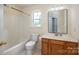 Bathroom with vanity, sink, mirror, toilet and tub-shower combination at 210 Park St, Bessemer City, NC 28016