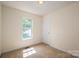 Bedroom featuring a window with outdoor views and neutral walls at 210 Park St, Bessemer City, NC 28016