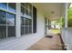 Charming front porch with black shutters and ample space for seating at 210 Park St, Bessemer City, NC 28016