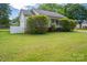 Charming home showcasing a well-maintained lawn and white picket fence at 210 Park St, Bessemer City, NC 28016