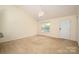 Bright living room featuring neutral walls and a vaulted ceiling at 210 Park St, Bessemer City, NC 28016