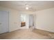 Spacious main bedroom with adjoining bathroom and additional hallway access at 210 Park St, Bessemer City, NC 28016