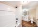 Bathroom features a modern tiled shower, vanity, and toilet at 210 W 15Th St, Newton, NC 28658