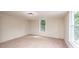 Bedroom featuring a window for natural light and neutral carpeting at 210 W 15Th St, Newton, NC 28658