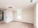 Well-lit bedroom features a window for natural light and a closet at 210 W 15Th St, Newton, NC 28658