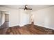 Bedroom with neutral walls, hardwood floors, closet, and access to a bathroom at 210 W 15Th St, Newton, NC 28658