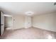 Cozy bedroom with neutral carpeting and an open doorway at 210 W 15Th St, Newton, NC 28658