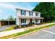 Charming two-story home with a covered front porch and an adjacent carport at 210 W 15Th St, Newton, NC 28658