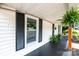 Inviting front porch featuring updated black paint, ferns, and white siding at 210 W 15Th St, Newton, NC 28658