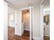 Hallway access into closet features hardwood floors and neutral wall colors at 210 W 15Th St, Newton, NC 28658