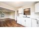 Modern white kitchen featuring stainless appliances, quartz countertops and hardwood floors at 210 W 15Th St, Newton, NC 28658