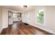 Open living area leading to the kitchen features hardwood floors and abundant natural light at 210 W 15Th St, Newton, NC 28658