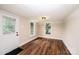 Bright living room with hardwood floors, white trim, and large windows bringing in natural light at 210 W 15Th St, Newton, NC 28658