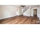 Spacious living room featuring hardwood floors and staircase access at 210 W 15Th St, Newton, NC 28658