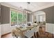 Bright dining room featuring large windows and an open layout to the living room at 2100 Sablewood Dr, Charlotte, NC 28205