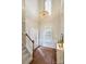 Bright and airy foyer featuring hardwood floors and an elegant chandelier at 2100 Sablewood Dr, Charlotte, NC 28205