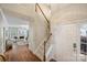 Bright foyer with hardwood floors and a staircase, leading to a spacious living area at 2100 Sablewood Dr, Charlotte, NC 28205