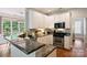 Modern kitchen featuring granite countertops, stainless steel appliances and hardwood floors at 2100 Sablewood Dr, Charlotte, NC 28205