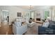 Spacious living room with a fireplace, neutral decor, and an open layout to the dining area at 2100 Sablewood Dr, Charlotte, NC 28205