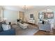 Bright living room with hardwood floors, fireplace, stylish decor and an open layout to the dining area at 2100 Sablewood Dr, Charlotte, NC 28205