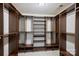 Spacious walk-in closet with custom shelves and rods offering ample storage solutions at 2100 Sablewood Dr, Charlotte, NC 28205